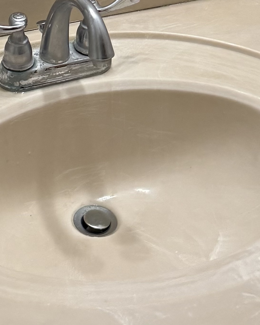 After — The same bathroom sink before and after a Clean Route Systems deep clean