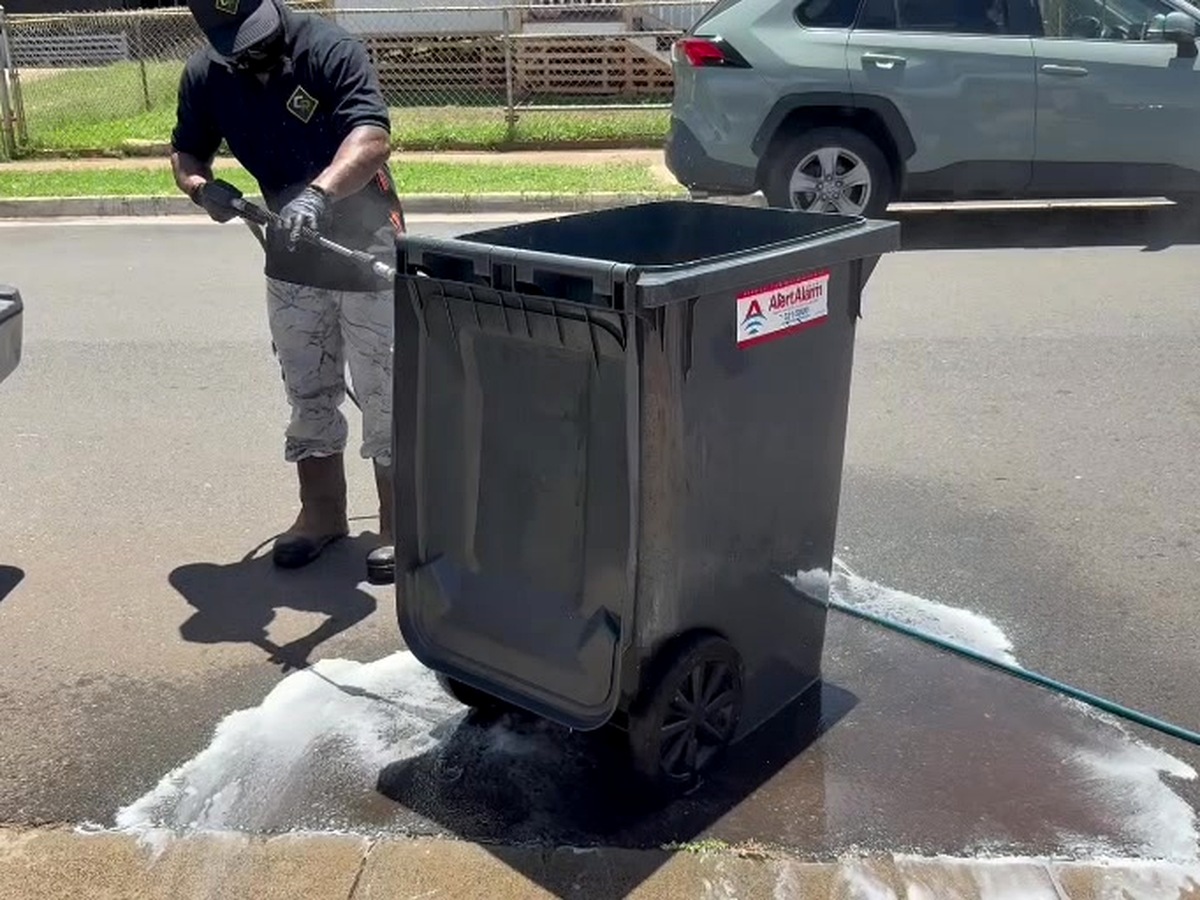 Clean Route Systems founder at work servicing a residential cart on Oʻahu