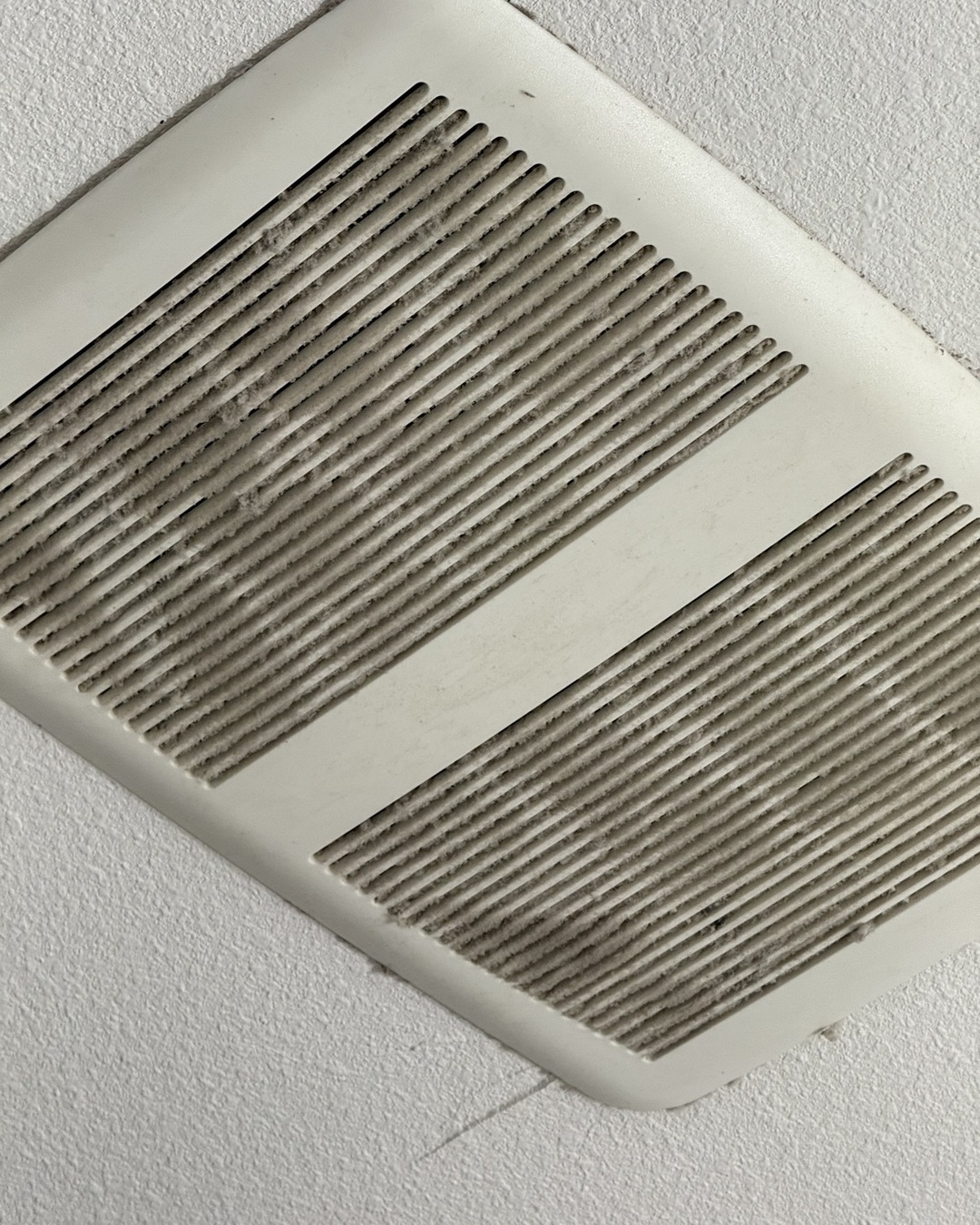 Before — The same interior vent before and after cleaning by Clean Route Systems